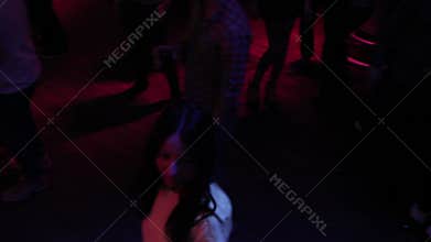 Men, women having alcoholic cocktails at nightclub, addiction