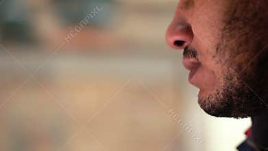 Unhappy young man drinking coffee alone, lonely person thinking about life
