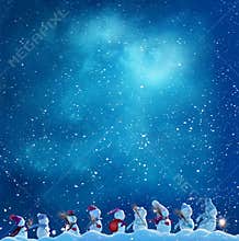 Many snowmen snowmen go in winter Christmas landscape