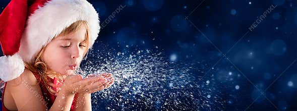 Christmas Wish Concept- Little Girl Blowing Snow - Christmas Wish Concept