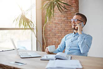 Positive emotions. Business concept. Cheerful professional adult caucasian finance manager in glasses and blue shirt