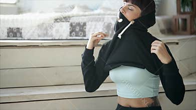 Happy woman is dressing for a run.