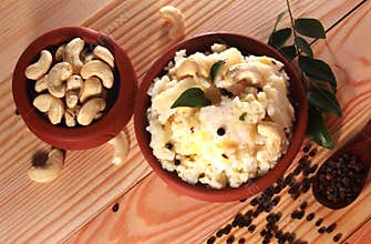 South indian food pongal with cashew nuts, pepper and curry leaves