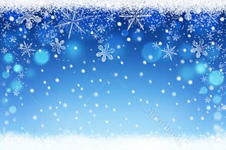 Beautiful blue blurred Christmas and Winter snow sky bokeh background with crystal snowflakes