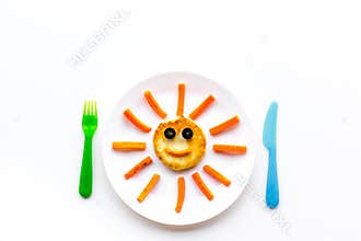 Creative approach to kid`s braekfast. Meal with cheesecake in shape of sun. White background top view