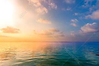 Relaxing and calm sea view. Open ocean water and sunset sky. Tranquil nature background. Infinity sea horizon