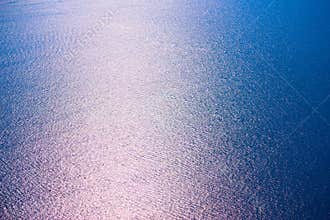 Sea water surface in sun glare