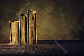 Old books vintage on wood floor and paper aged background or tex