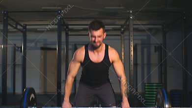 Crossfit fitness gym heavy weight lifting bar by strong man workout