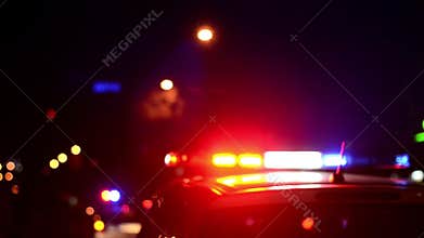 Traffic police officers works on the street. Policeman at work. Police emergency lights flash at night. Car accident. Crime scene.