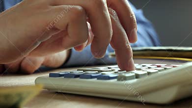 Hand counting on a calculator. Bookkeeping and accounting concept.