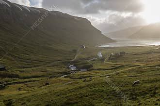 Waterfalls blown dramatically upwards by a heavy storm making them look like steam pipes, at the Faroe Islands.