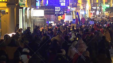 Many people walking on night street protests for their rights