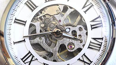 Old vintage analog clock mechanism watch time going fast, closeup detail timelapse time running fast