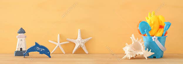 Vacation and summer banner with sea life style objects and beach toys for kid.