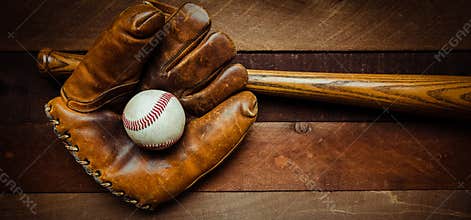 Vintage baseball gear on a wooden background