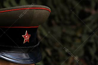Shallow depth of field. A symbol of a Soviet soldier: a cap with a five-pointed star. Officer of the USSR during the Great Patriot