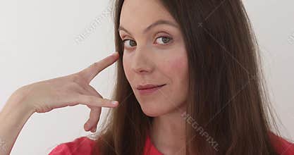 Beautiful woman gesturing call me isolated