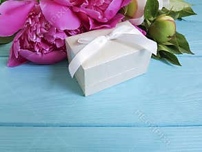 Peonies gift box composition vintage birthday romance a blue wooden background