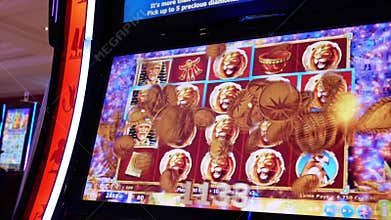 Motion of people playing slot machine and winning big prize