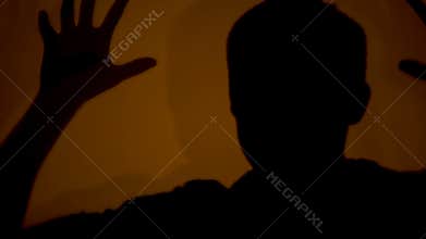 Shadow of madman showing terrible and evil actions, psychiatric hospital