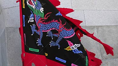 SEOUL, SOUTH KOREA - MAY 19, 2018: Traditional Korean Royal Flag Waving During Changing Guards Ceremony at Gyeongbokgung