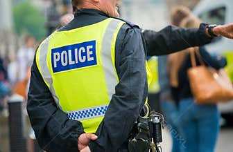 Police stand by to ensure public safety at a Stand Up To Racism demonstration.