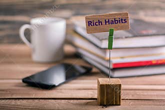 Rich habits sign