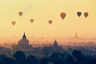 Air hot balloons floating on top pagoda at Bagan , Myanmar