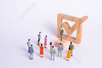 Man stands and shakes people on the background checkbox. The concept of democratic elections, political process, referendum.