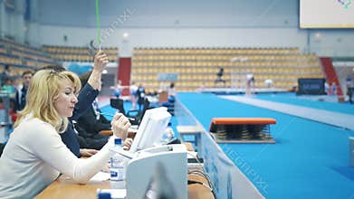 KAZAN, RUSSIA - APRIL 19, 2018: All-Russian gymnastics championship - Judges waved the flag