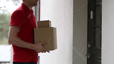 Delivery service courier ringing the house doorbell