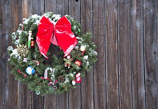 Old fashioned Christmas wreath western style rustic wreath on wood background
