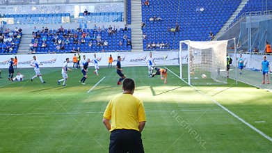 Soccer match, goalkeeper parries blow
