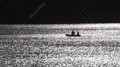 Romantic couple on boat with paddles