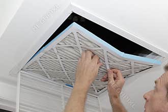 Man Removing Dirty Air Filter