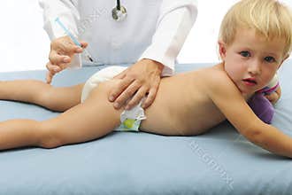 Vaccination: doctor injecting baby