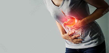 Woman touching stomach painful from stomachache.