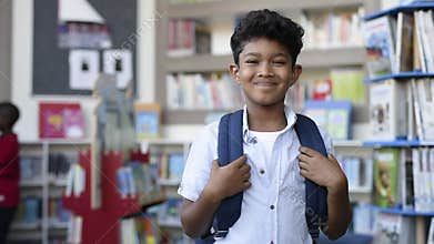 Smiling hispanic boy at school