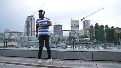 Funky dancer moonwalk dancing on city street