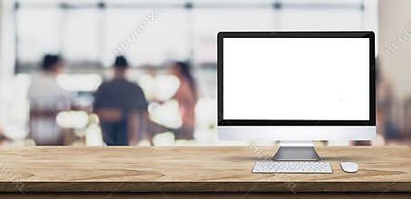 Blank screen desktop computer on wooden table top with blur people working at creative office bokeh background,Mock up for