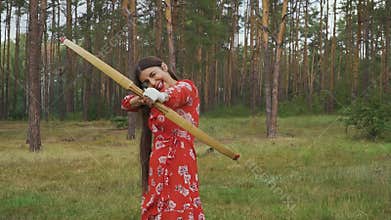 Girl choosing different targets for archery