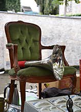 Armchair and brass tube on garage sale