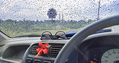CAR Window glass ON THE GO -TRAVELLING with condensation of natural water drops. Abstract photo.