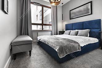 Modern bedroom with blue bed