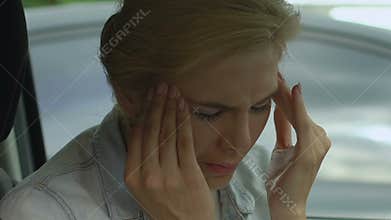 Lady in car has migraine attack, depression and anxiety among middle-aged women