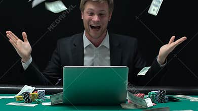 Happy man enjoying victory in rain of money, sports betting, online casino
