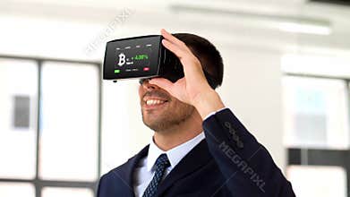 Businessman with virtual reality headset at office