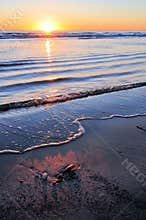 Sunrise over calm ocean