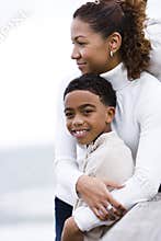 Close-up of African-American mother embracing son